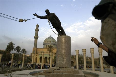 saddam hussein statue.